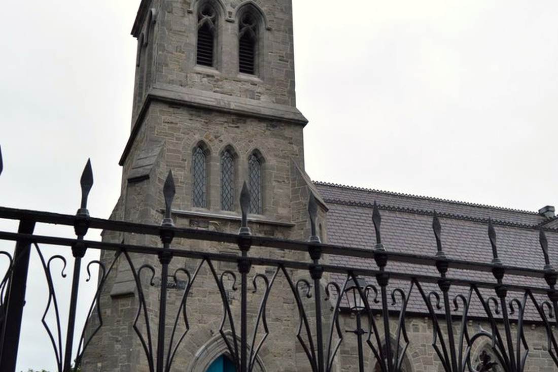 The glass spire and blue door of Pearse Lyons Distillery